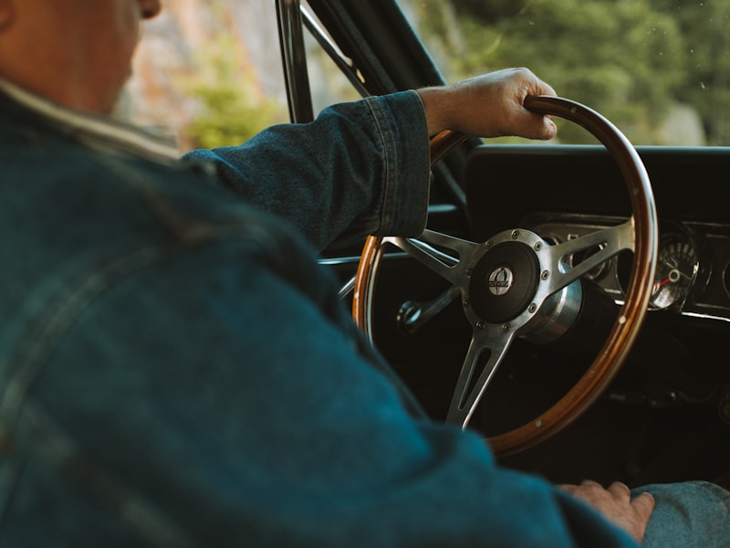 Young driver practicing driving skills in a lesson car